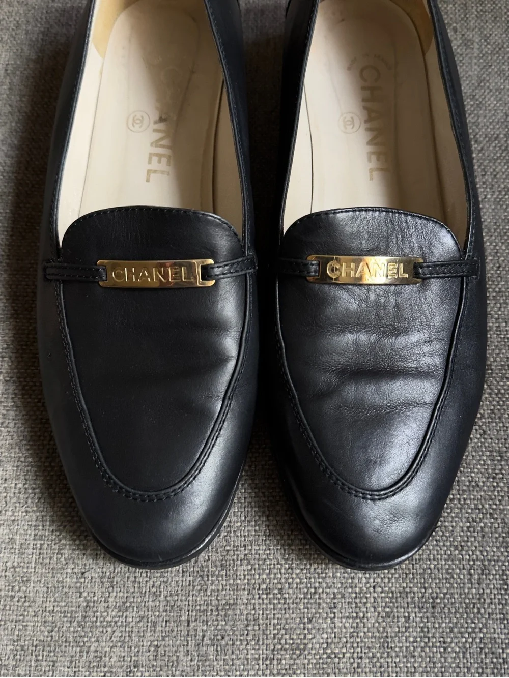 Vintage Chanel black loafers with gold hardware